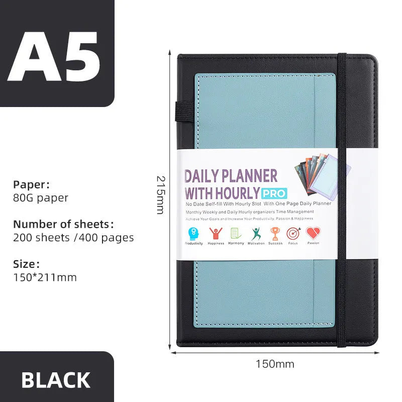 A6 self-filled notebook with PU cover in various colours, shown open on wooden table.
