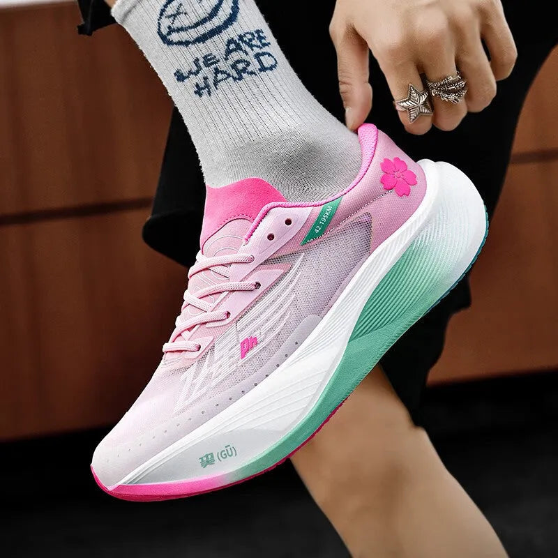 Low-top unisex racing sneaker with carbon plate, shown in Glacier colour with front lace-up detail.