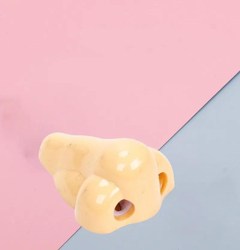 Flesh colour geometry plastic pencil sharpener with big nostril hole measuring 58x45x30mm
