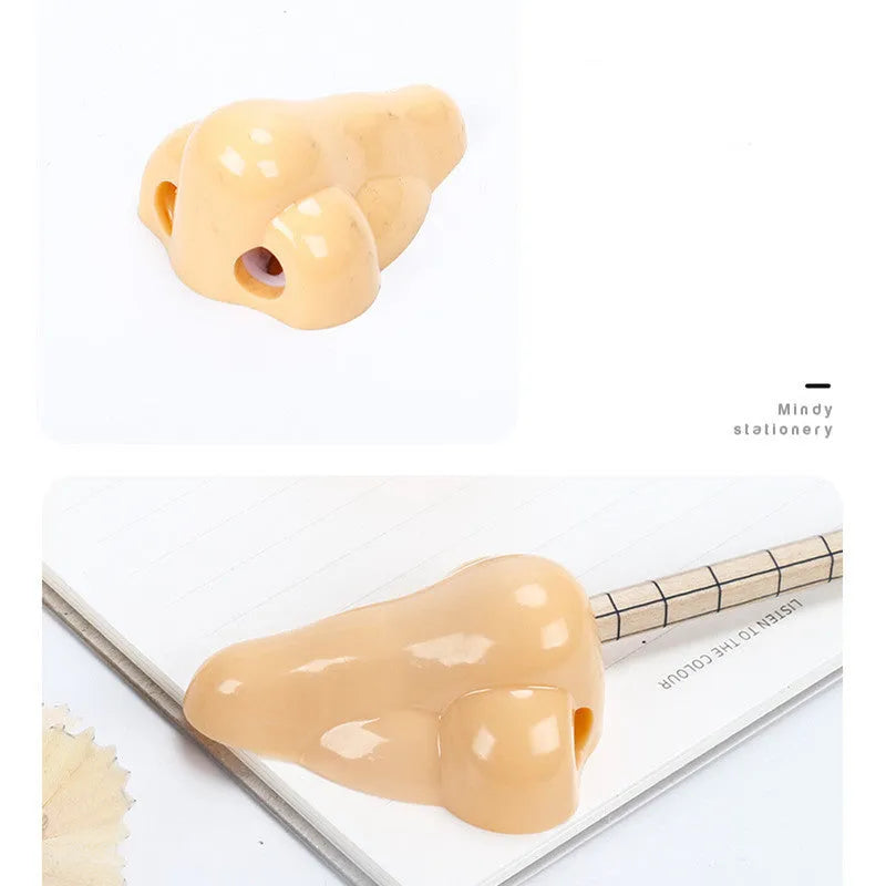 Flesh colour geometry plastic pencil sharpener with big nostril hole measuring 58x45x30mm