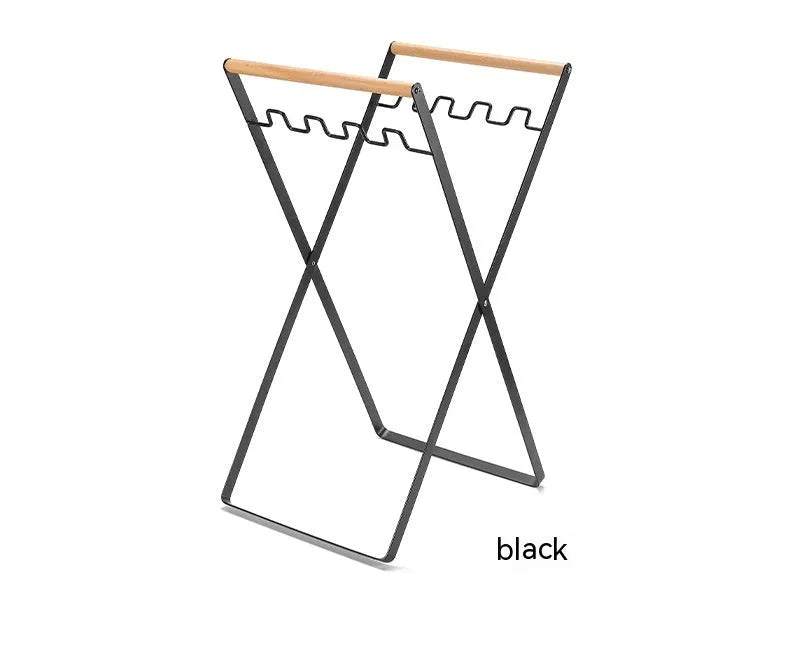 Iron and wooden folding trash storage rack for outdoor rubbish bags.