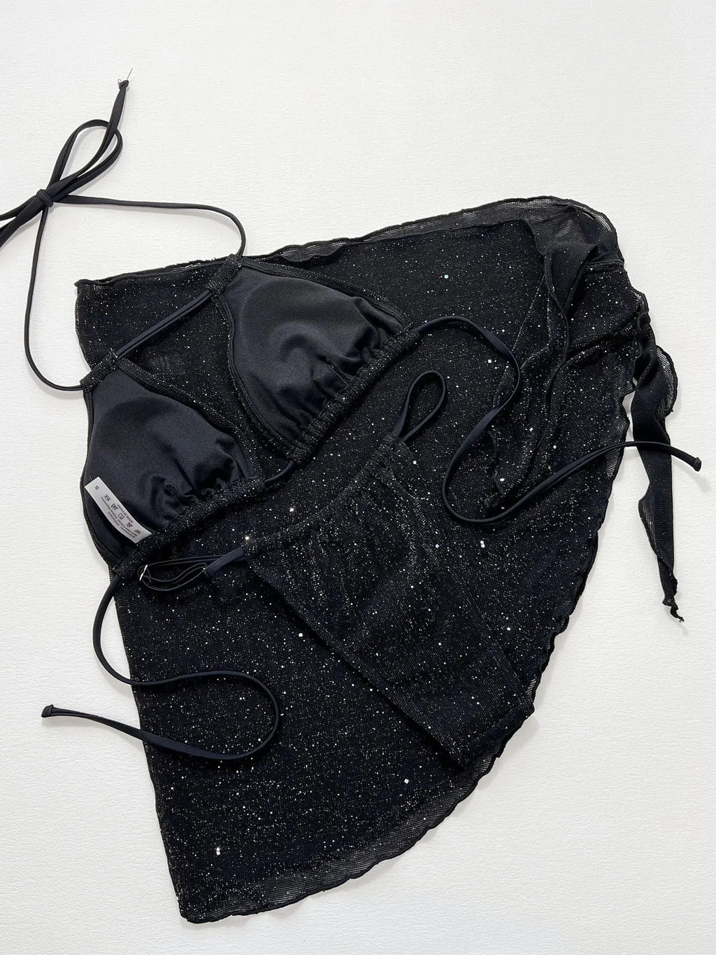 Black three-piece polyester bikini set with separate top and shorts