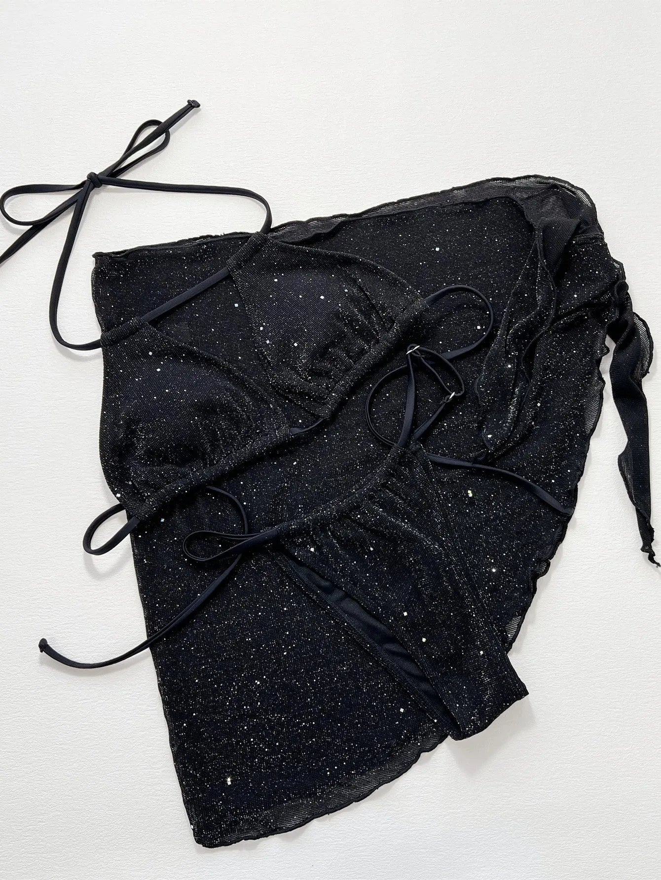 Black three-piece polyester bikini set with separate top and shorts