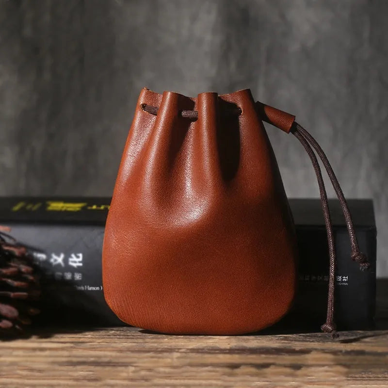 Genuine cowhide leather drawstring bundle wallet in retro style, shown in black.