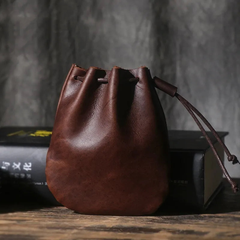 Genuine cowhide leather drawstring bundle wallet in retro style, shown in black.