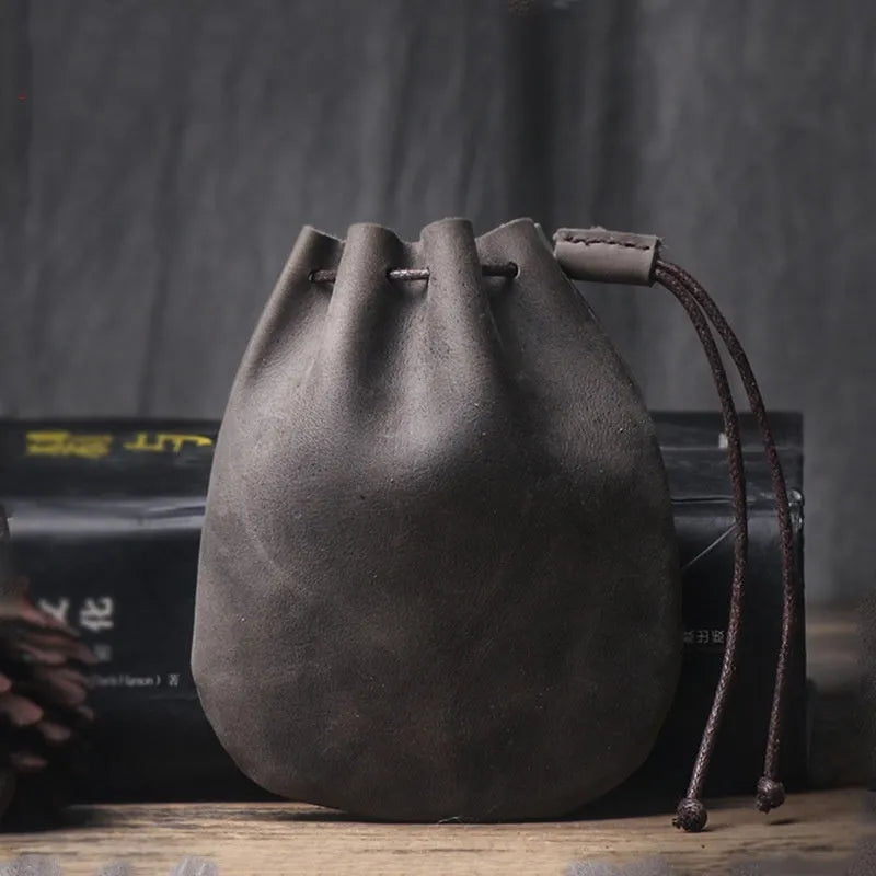 Genuine cowhide leather drawstring bundle wallet in retro style, shown in black.