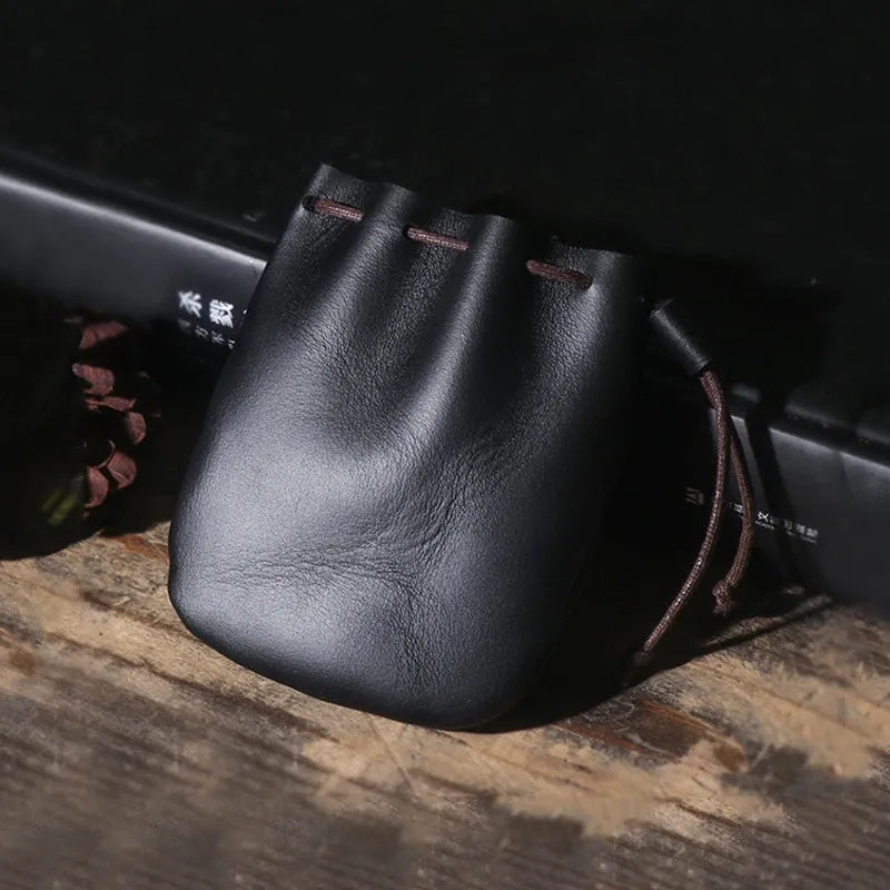 Genuine cowhide leather drawstring bundle wallet in retro style, shown in black.
