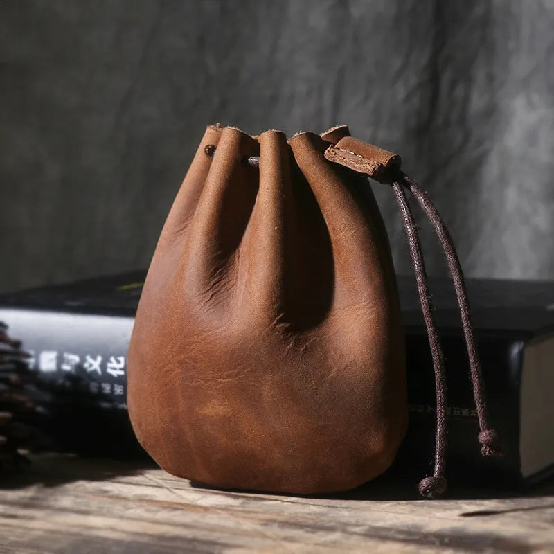 Genuine cowhide leather drawstring bundle wallet in retro style, shown in black.