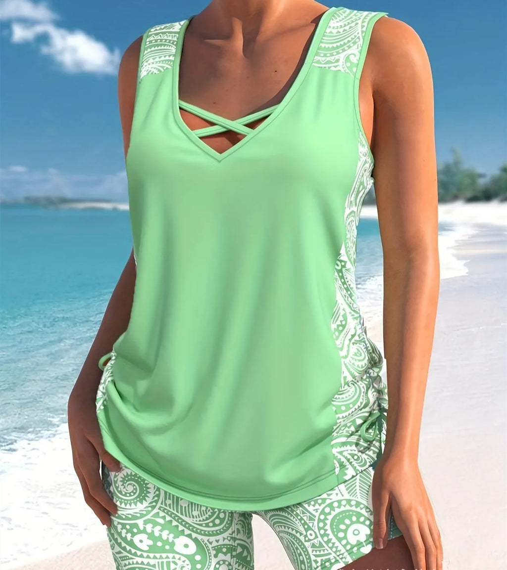 Women's printed boxer-style swimsuit set with matching top and shorts on a neutral background.
