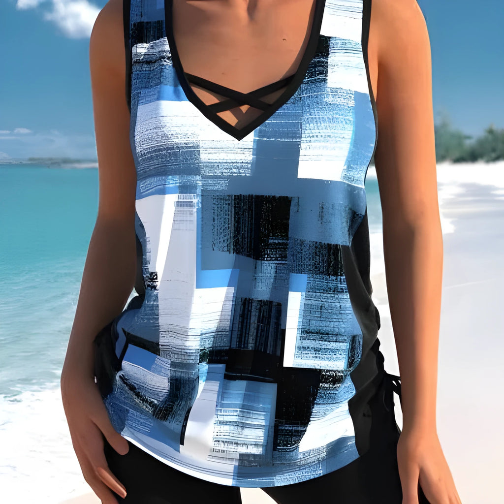 Women's printed boxer-style swimsuit set with matching top and shorts on a neutral background.