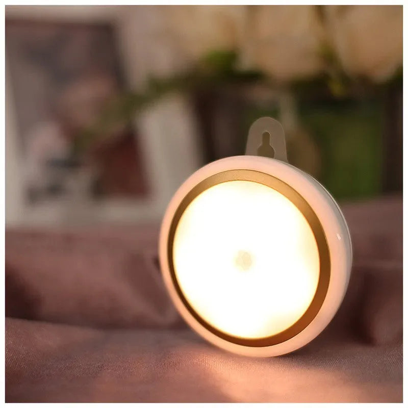 Circular white motion sensor LED light unit with a diameter of 80mm.