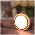 Circular white motion sensor LED light unit with a diameter of 80mm.