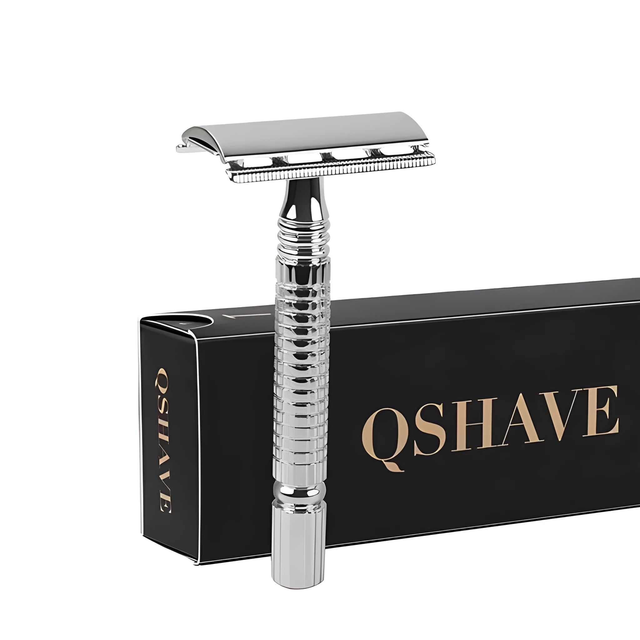 Double edged safety razor with chrome-plated brass handle and closed comb head on a storage box.