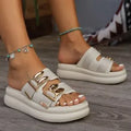 Women's apricot suede slippers with a thick rubber sole, shown from the side.