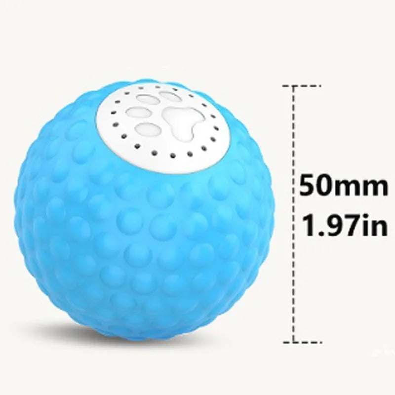 Remote control and a blue smart cat ball toy on a wooden floor.