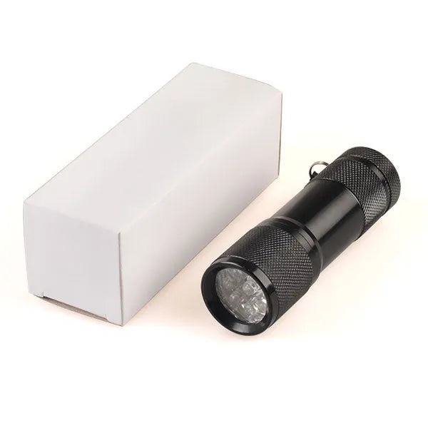 Black aluminium Smart Vein Locator device with red LED lights on, showing size against a hand.