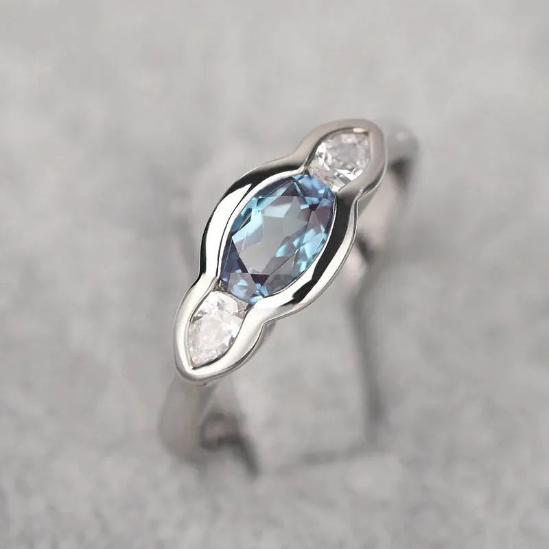 Women's geometric ellipse copper ring with inlaid zircon detail in white gold colour.