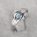 Women's geometric ellipse copper ring with inlaid zircon detail in white gold colour.