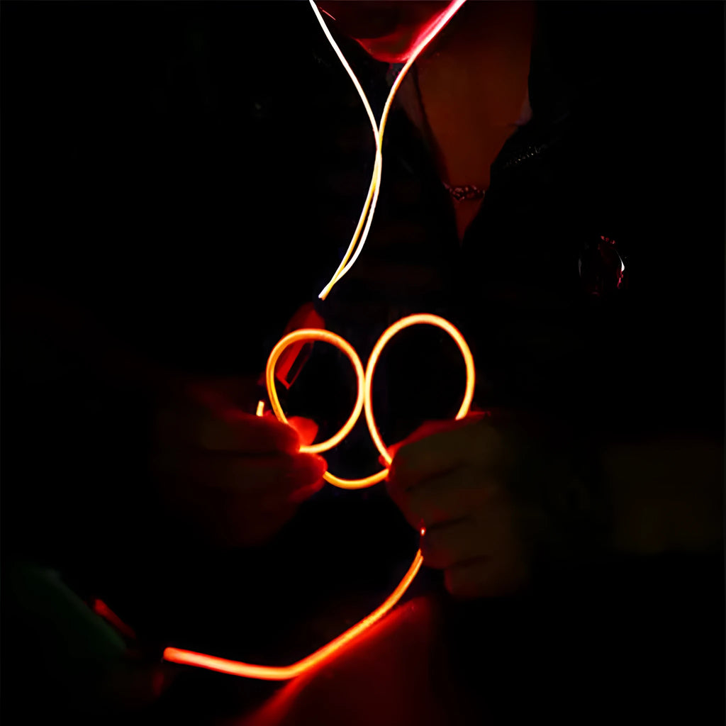 Blue LED light-up earphones with 3.5mm jack and in-line remote control on a white background.