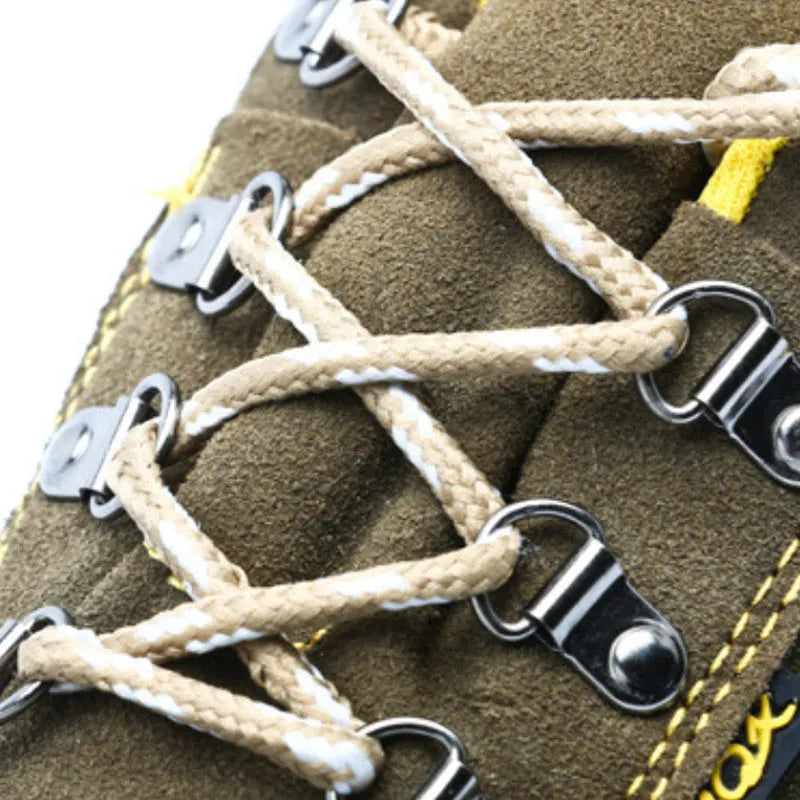 Bronze coloured cow suede leather safety boots with a steel toe cap on a non-slip sole.