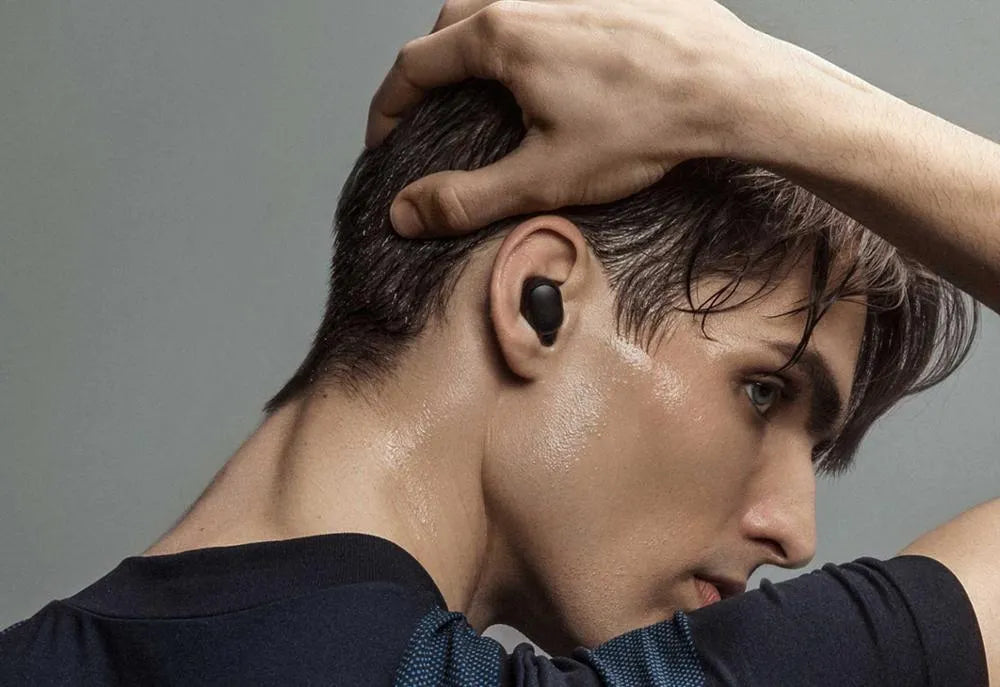 Redmi AirDots black true wireless earbuds with charging case.