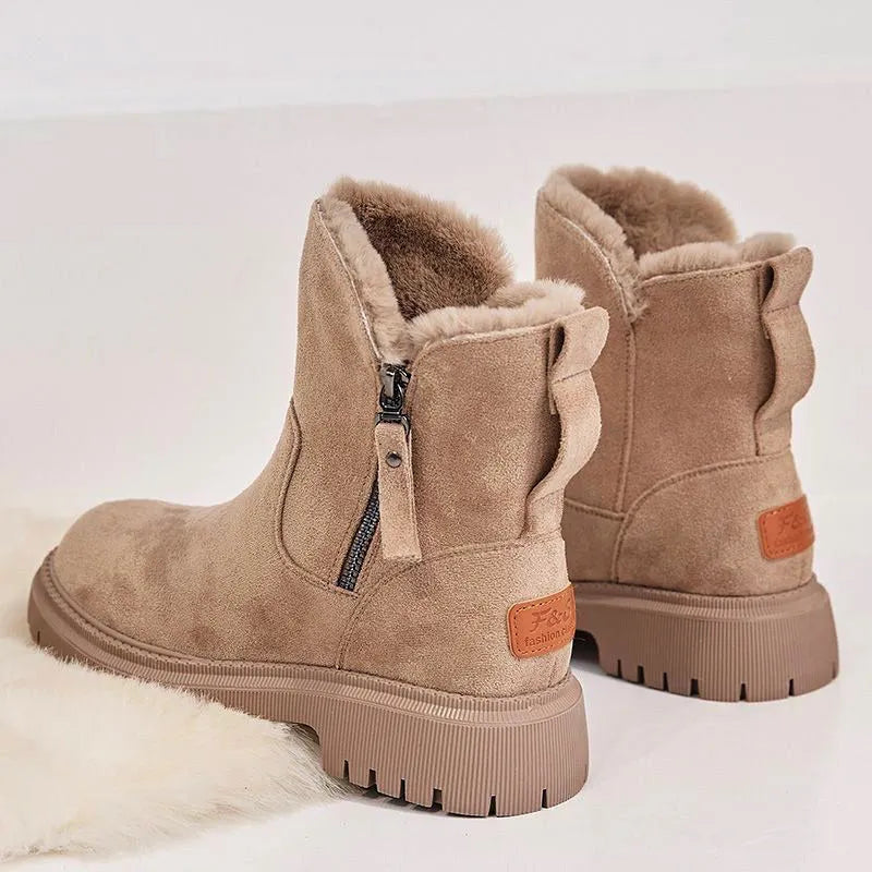 Women's black faux suede high-top snow boots with a side zipper and thick plush lining.