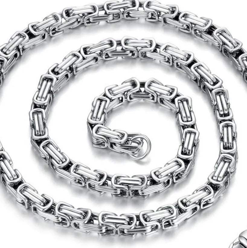 Stainless steel punk necklace with 5mm chain in steel finish on black background