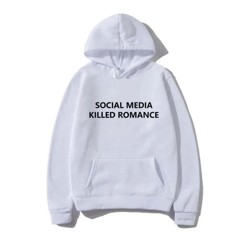 Man wearing a slim fit grey hoodie with a printed spring letter design on the front.