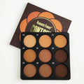 Dark matte makeup palette open showing nine waterproof eyeshadow shades.