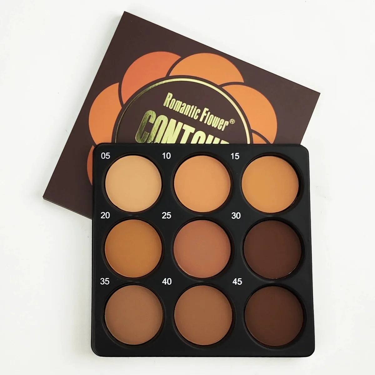 Dark matte makeup palette open showing nine waterproof eyeshadow shades.