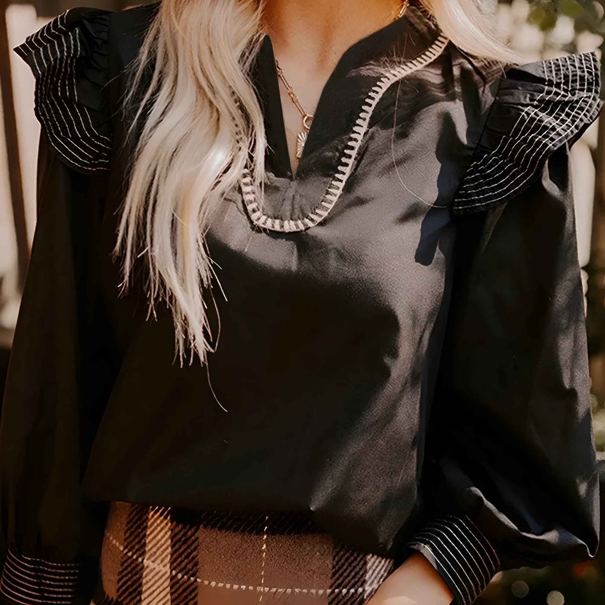 Black women's v-neck blouse with ruffle long sleeves and contrast stitching