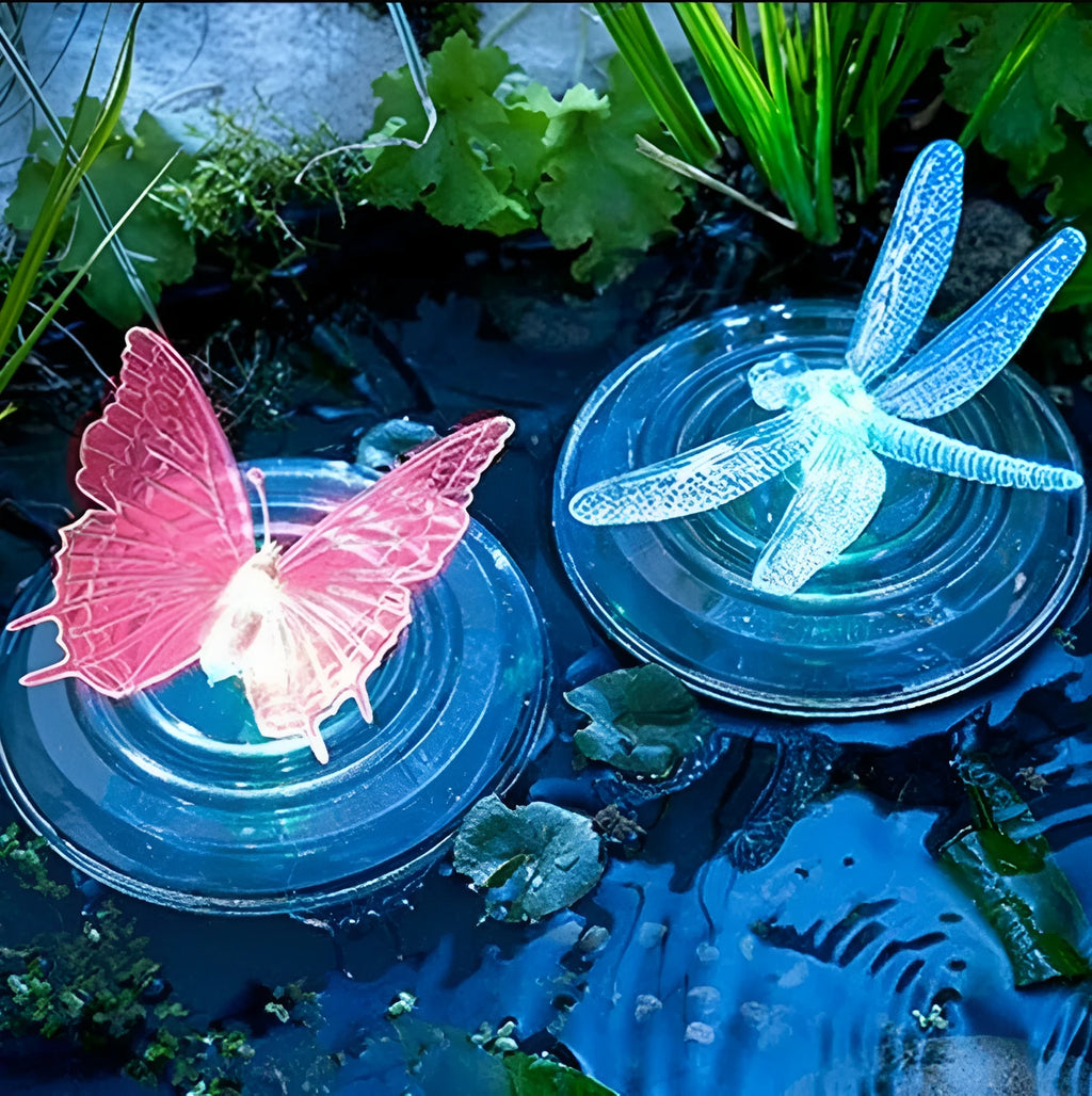 Solar LED float lamp with dragonfly ornament floating on pond water showing 7 colour changing lights