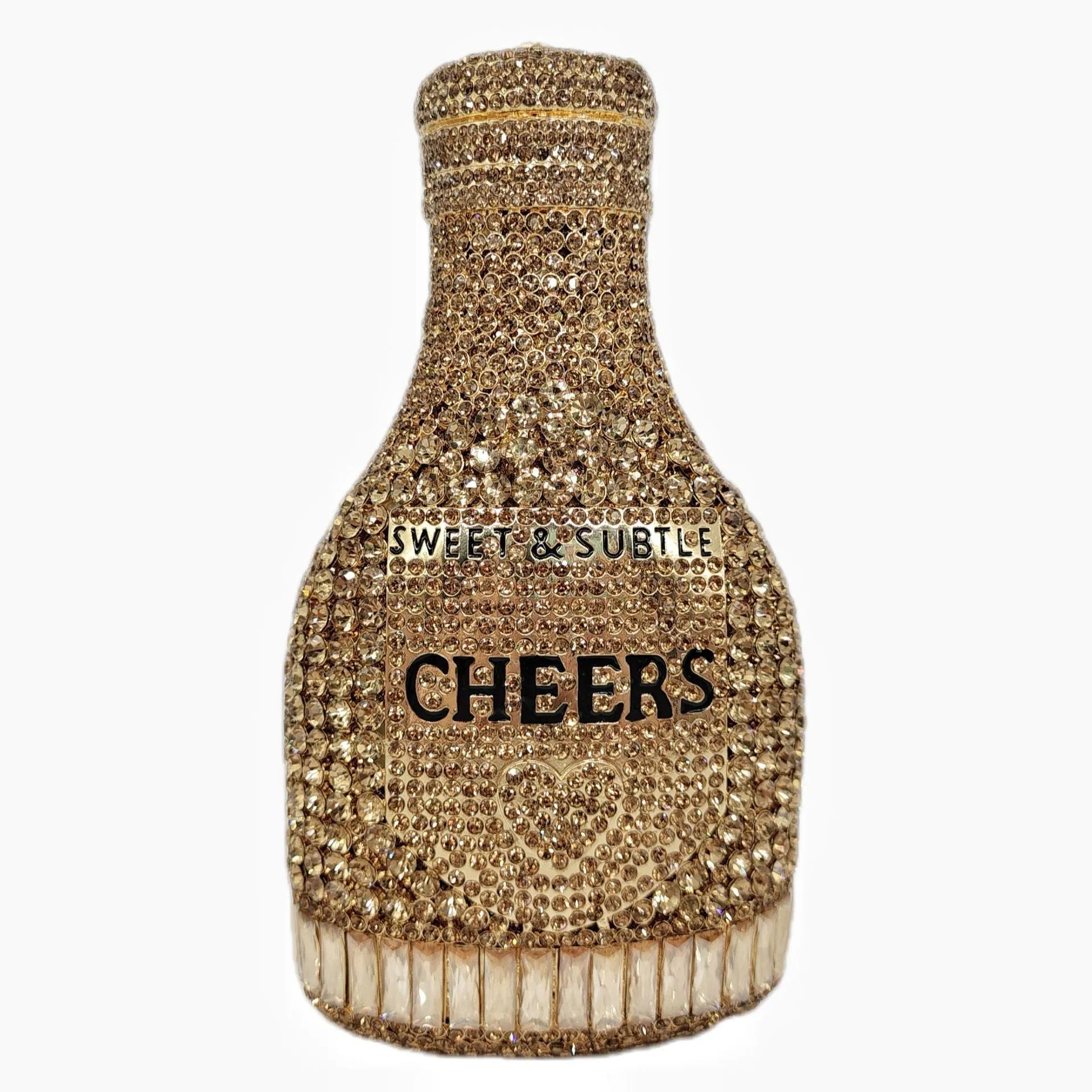 Gold hard-shell clutch bag shaped like a champagne bottle with crystal accents on a black background.