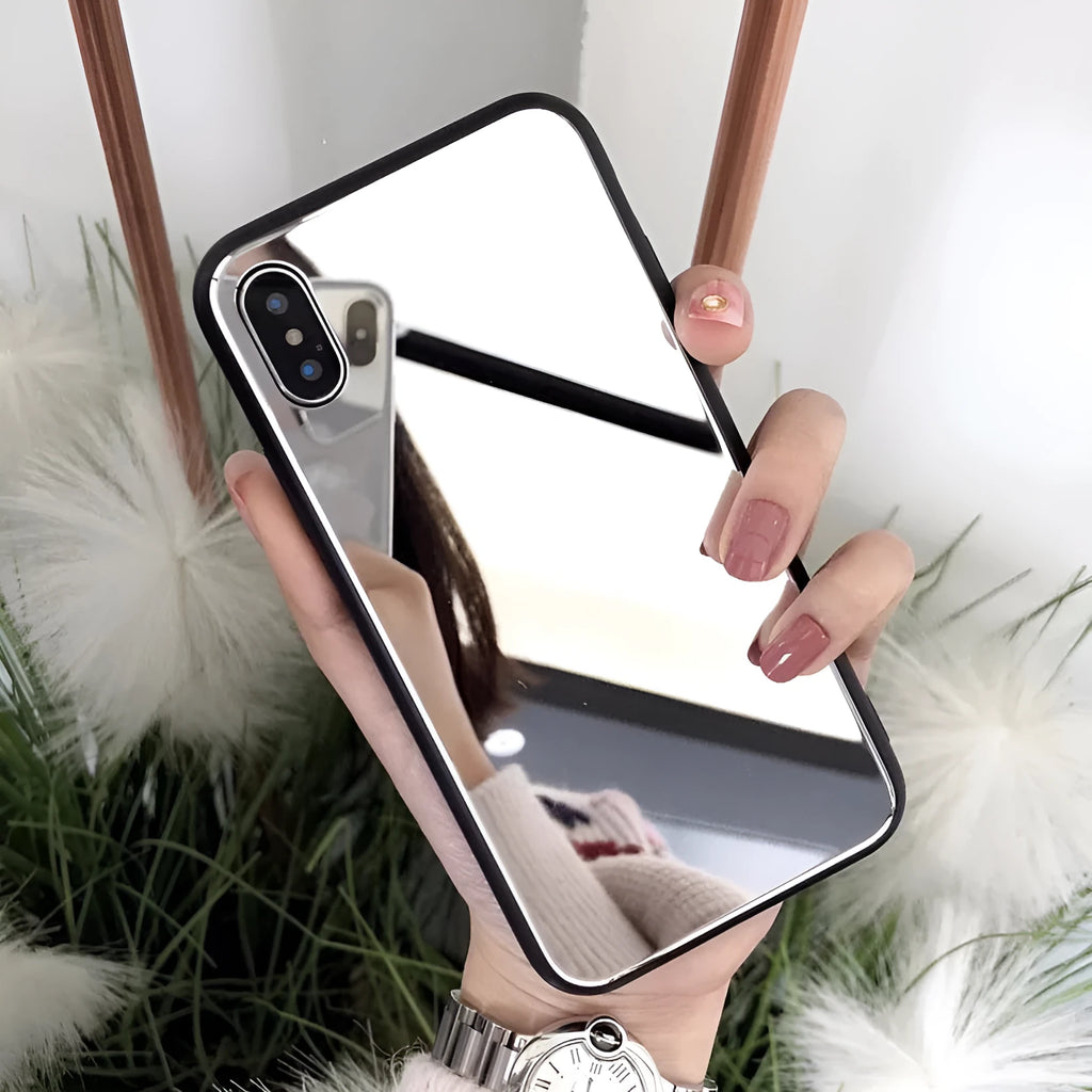 Black iPhone case with a mirrored back panel, shown next to an iPhone.