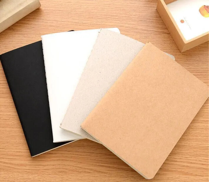 Retro solid-colour A6 graffiti notebook open on a blank page.