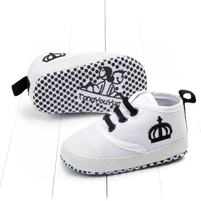 Canvas toddler shoes with elastic band in red and white on neutral background