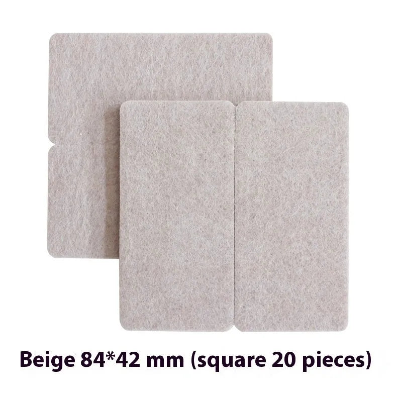 Assorted beige plastic furniture leg protectors in round and square shapes on hardwood floor