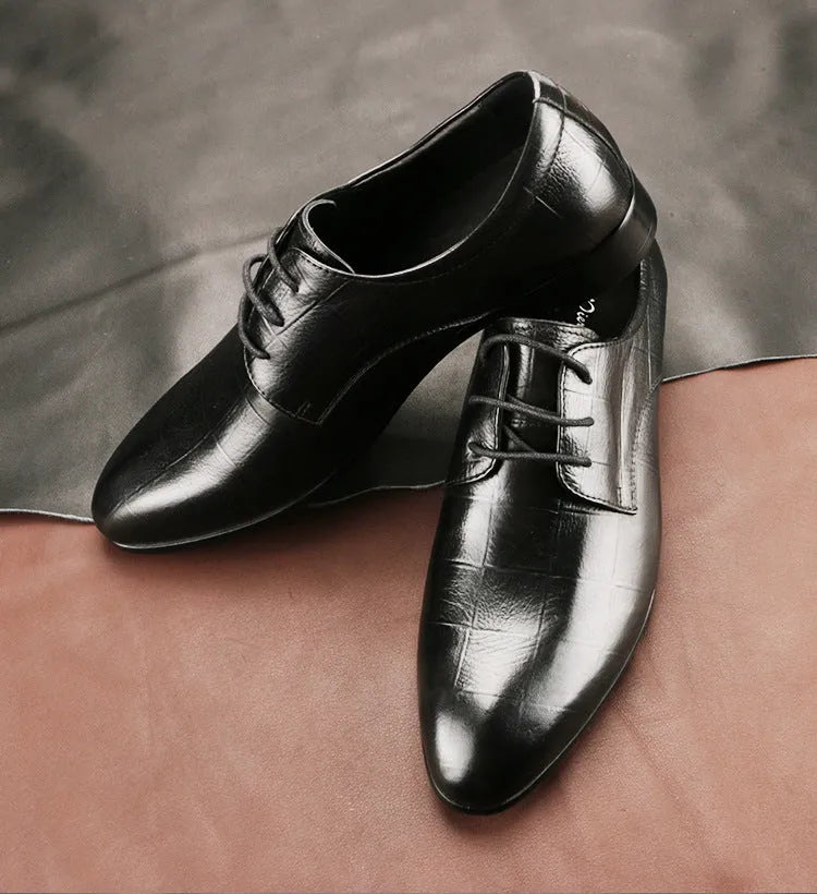 Men's black checkered leather derby shoes with a pointed toe on a rubber sole