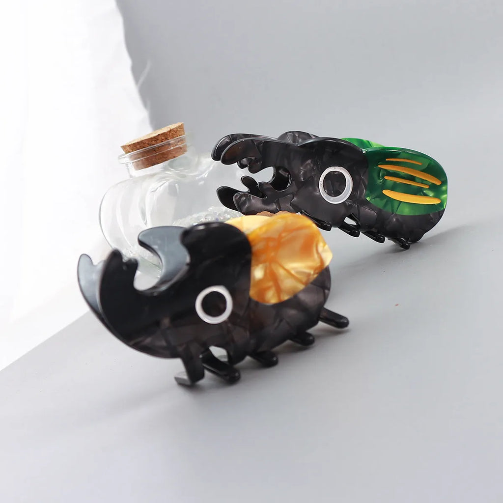 Handmade cartoon beetle and caterpillar design grip made from green cellulose acetate for stationery