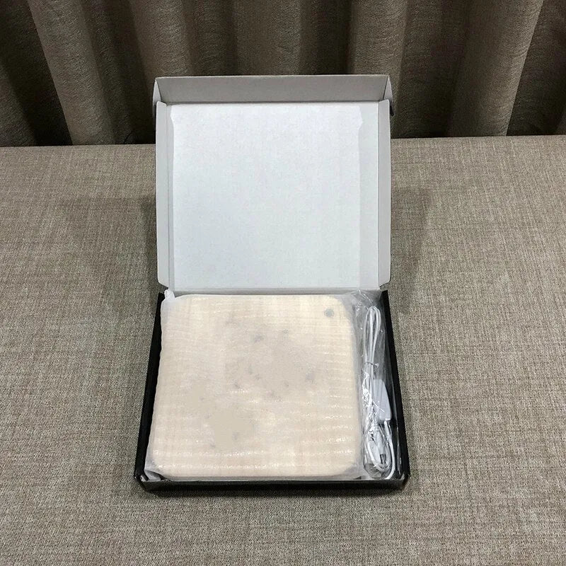 Square pine wood USB LED atmosphere lamp emitting warm white light on a desk.