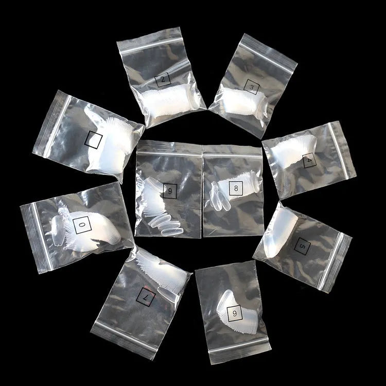 500 clear ABS false nail tips in 10 different sizes on a white background