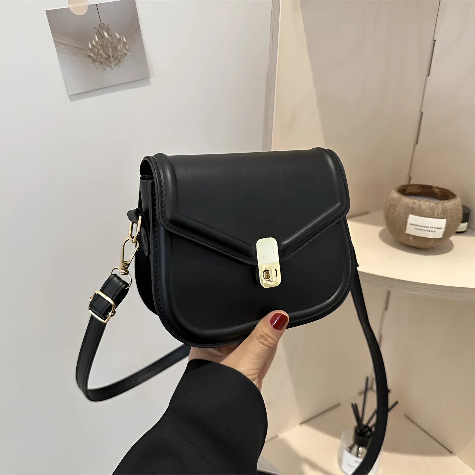 Soft PU leather messenger bag with clamshell opening shown in horizontal square shape on a shoulder strap.