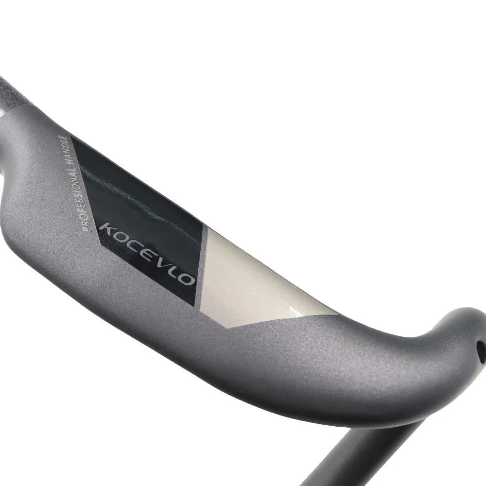 Wei Bike matt black carbon fibre road bike handlebar showing its bent shape and clean finish.