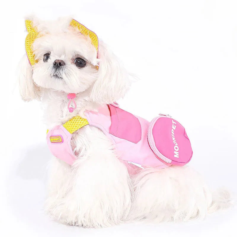 Pink polyester pet vest for small to medium dogs on a Bichon Frise