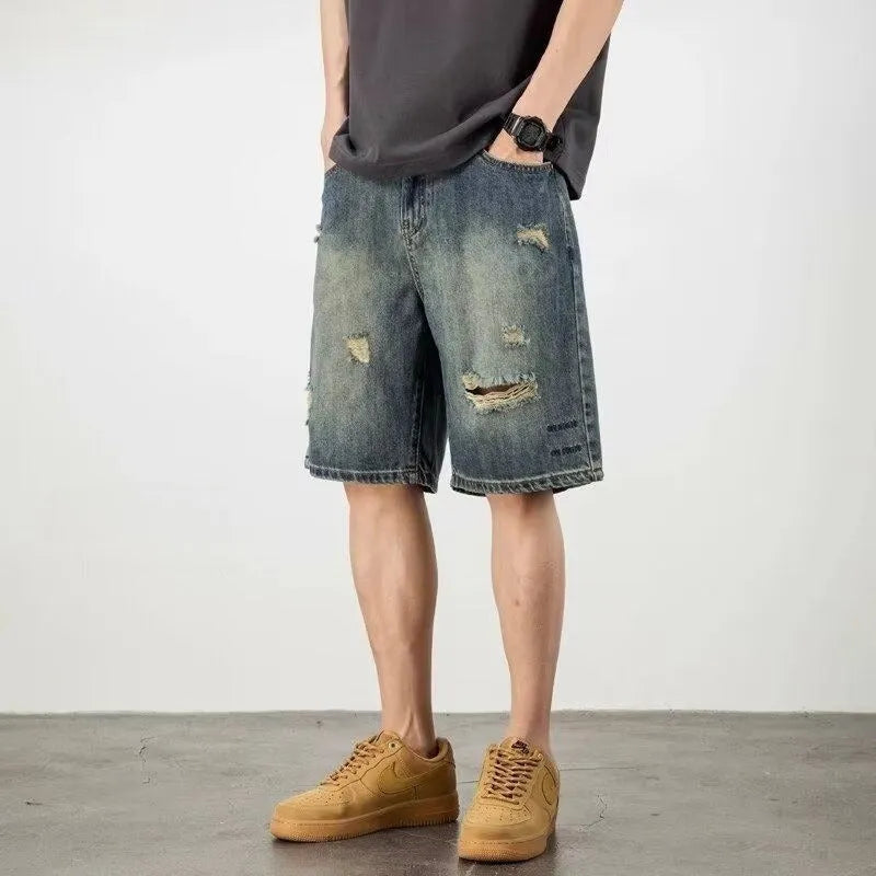 Men's blue denim shorts with retro loose hole design and straight cut