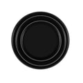 Set of four round, 20mm diameter silicone car door shock pads in black and luminous colours on a car door edge.