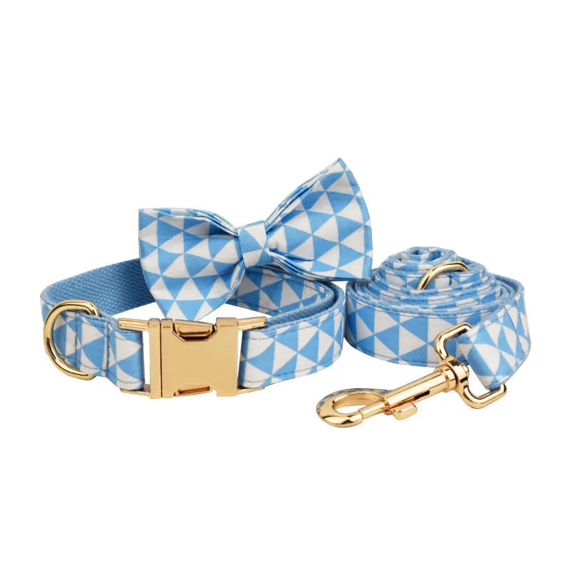 Blue cloth dog collar, leash, vest, and bow four-piece pet accessory set