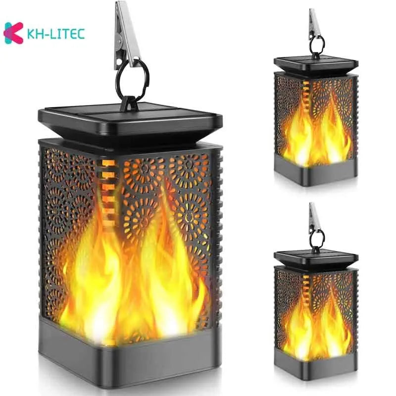 Set of four black solar-powered hanging garden lights with a flickering flame LED effect.