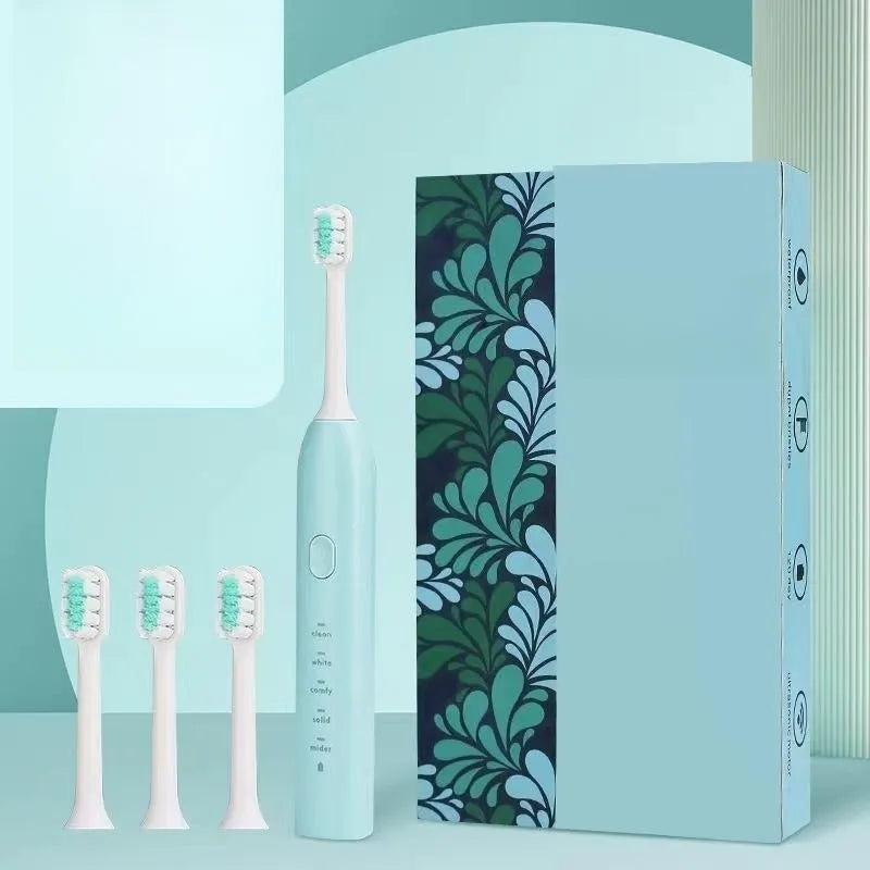 Rechargeable electric toothbrush with small yellow duck design, soft bristles, and USB charging cable