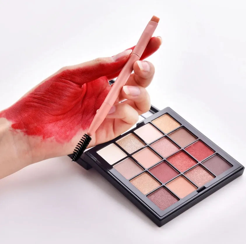 Ten professional makeup brushes with pink painted wooden handles and nylon bristles, including powder, foundation, and double-ended brushes.